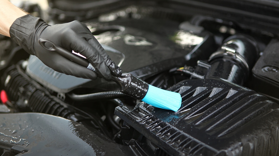 car maintenance with a brush